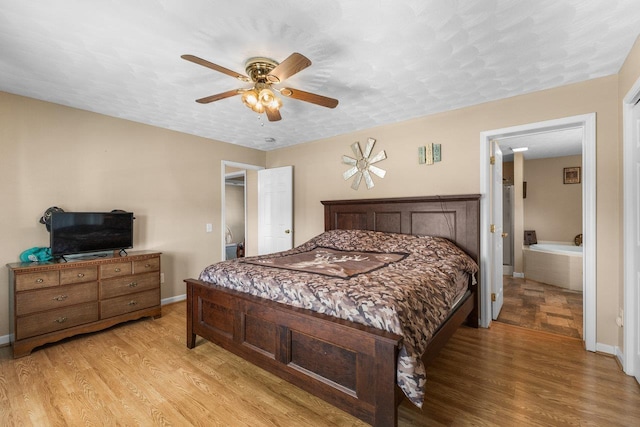 18785 Red Brush Rd, Elkton, VA 22827 - bedroom featuring light wood-type flooring, baseboards, and ceiling fan