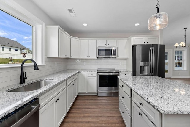 LOT155 Langley Dr, Waynesboro, VA 22980 - kitchen with appliances with stainless steel finishes, a sink, white cabinetry, backsplash, and dark wood-type flooring