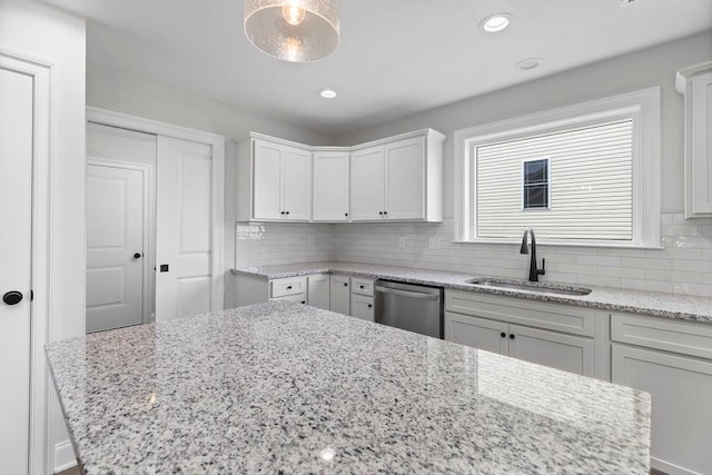 LOT155 Langley Dr, Waynesboro, VA 22980 - kitchen with stainless steel dishwasher, a sink, tasteful backsplash, white cabinets, and light stone countertops