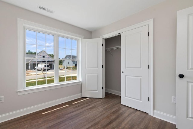LOT155 Langley Dr, Waynesboro, VA 22980 - unfurnished bedroom with baseboards, multiple windows, dark wood-style floors, and a closet