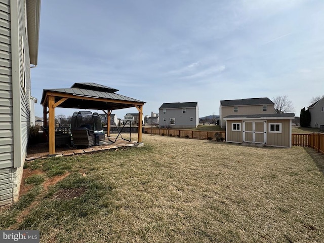 view of yard with a gazebo, a storage unit, and an outdoor structure
