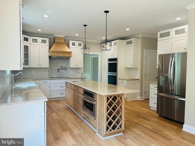 11506 Light Ln, Spotsylvania, VA 22551 - kitchen with appliances with stainless steel finishes, a sink, custom exhaust hood, crown molding, and backsplash