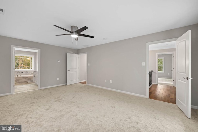11506 Light Ln, Spotsylvania, VA 22551 - unfurnished bedroom with carpet floors, baseboards, ensuite bath, and ceiling fan