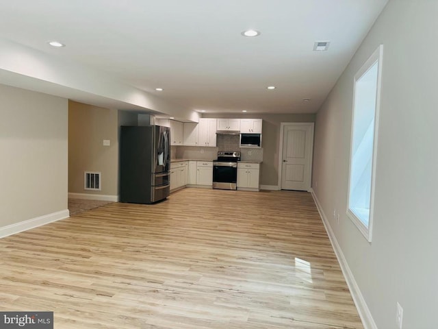 11506 Light Ln, Spotsylvania, VA 22551 - unfurnished living room featuring light wood finished floors, baseboards, and recessed lighting