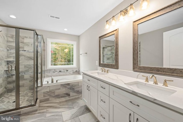 11506 Light Ln, Spotsylvania, VA 22551 - bathroom with a bath, a shower stall, double vanity, and recessed lighting