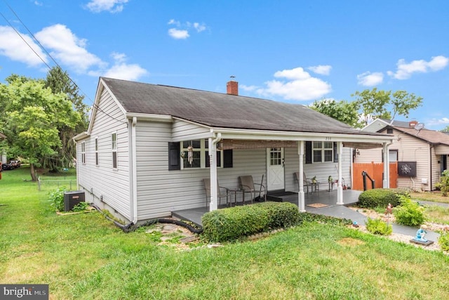 234 Landon Ln, Orange, VA 22960 - bungalow-style home featuring central AC unit, a chimney, a shingled roof, and a patio