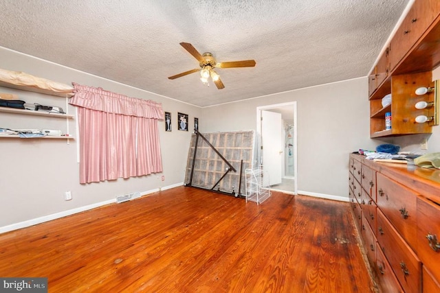 234 Landon Ln, Orange, VA 22960 - unfurnished room with a textured ceiling, ceiling fan, wood finished floors, and baseboards
