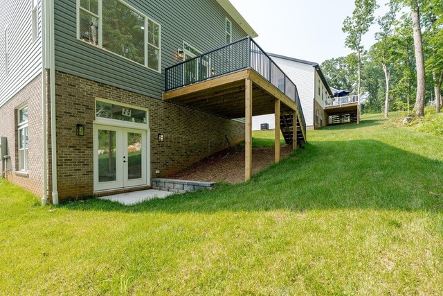 4125 Romney Ct, Rockingham, VA 22802 - rear view of property with a wooden deck, brick siding, a lawn, stairs, and french doors