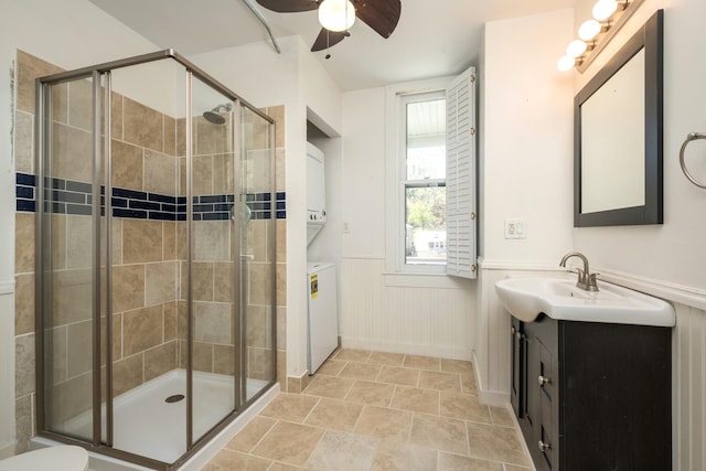 940 Beverley St W, Staunton, VA 24401 - full bath with stacked washer / dryer, a shower stall, wainscoting, a ceiling fan, and vanity
