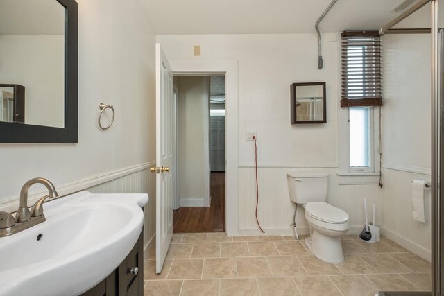 940 Beverley St W, Staunton, VA 24401 - bathroom with a sink, toilet, and a wainscoted wall
