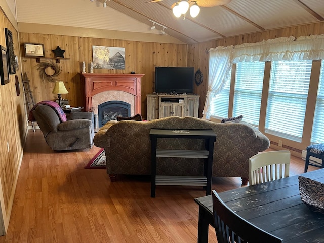 290 Shenandoah River Rd, Shenandoah, VA 22849 - living area featuring lofted ceiling, ceiling fan, track lighting, wooden walls, and wood finished floors