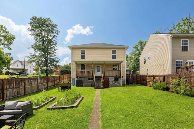 832 Grayson Ave, Waynesboro, VA 22980 - rear view of house with a garden and a fenced backyard
