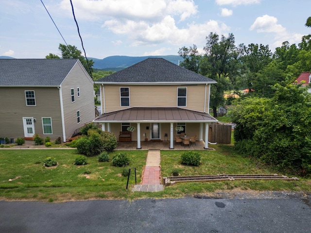 832 Grayson Ave, Waynesboro, VA 22980 - view of front of house with covered porch, a front yard, a standing seam roof, and a metal roof