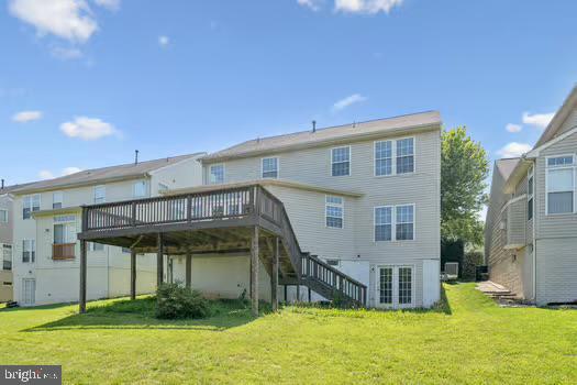 1025 Riverdale Cir, Culpeper, VA 22701 - back of house featuring a wooden deck, stairs, and a lawn