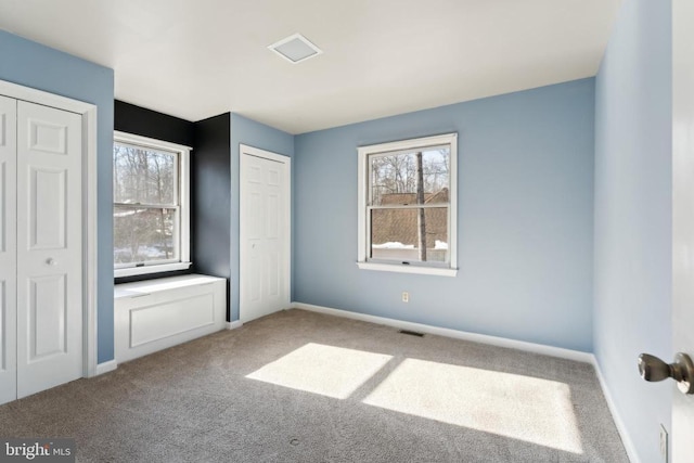 201 Happy Creek Rd, Locust Grove, VA 22508 - unfurnished bedroom featuring carpet flooring, multiple windows, and baseboards