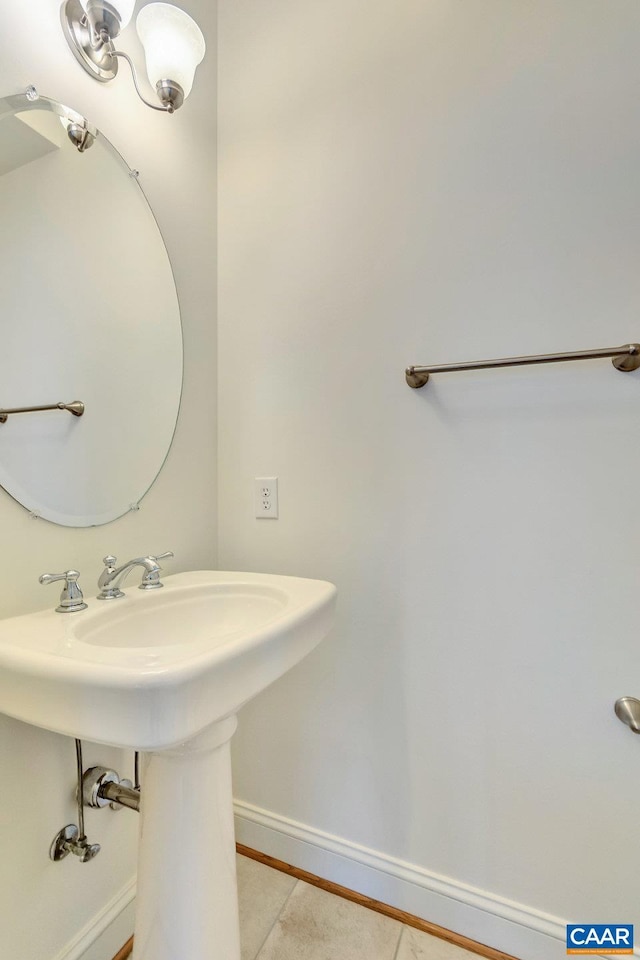 bathroom featuring tile patterned flooring and baseboards