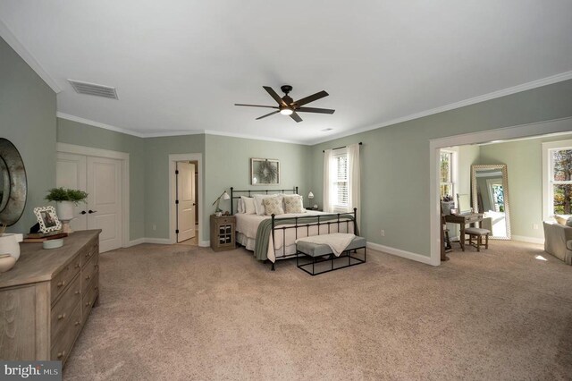 11001 Waterstone Pl, Spotsylvania, VA 22551 - bedroom featuring crown molding, light carpet, baseboards, and a ceiling fan