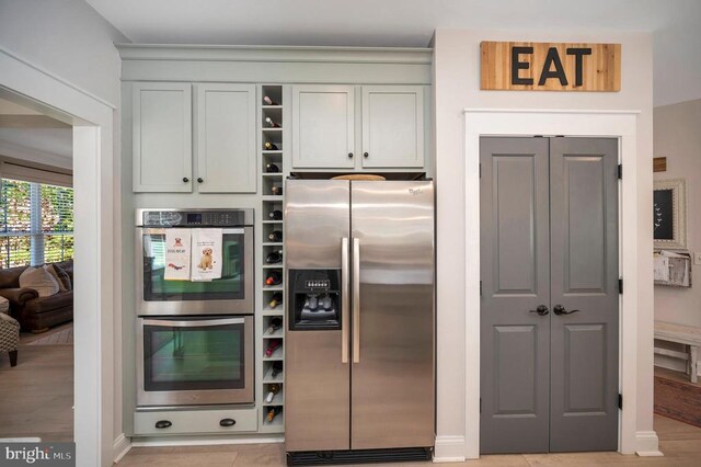 11001 Waterstone Pl, Spotsylvania, VA 22551 - kitchen featuring appliances with stainless steel finishes, open shelves, and baseboards