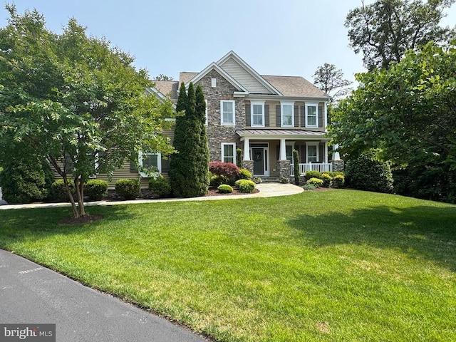 11001 Waterstone Pl, Spotsylvania, VA 22551 - craftsman inspired home with stone siding, covered porch, a front yard, a standing seam roof, and metal roof