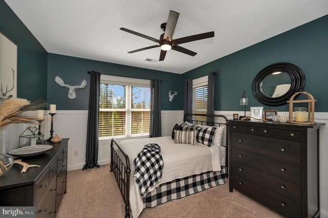 11001 Waterstone Pl, Spotsylvania, VA 22551 - bedroom with a wainscoted wall, multiple windows, light colored carpet, and ceiling fan