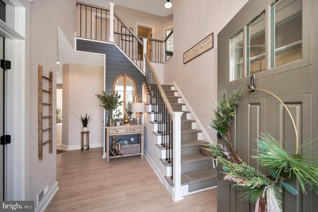 11001 Waterstone Pl, Spotsylvania, VA 22551 - foyer entrance featuring a high ceiling, wood finished floors, stairway, and baseboards