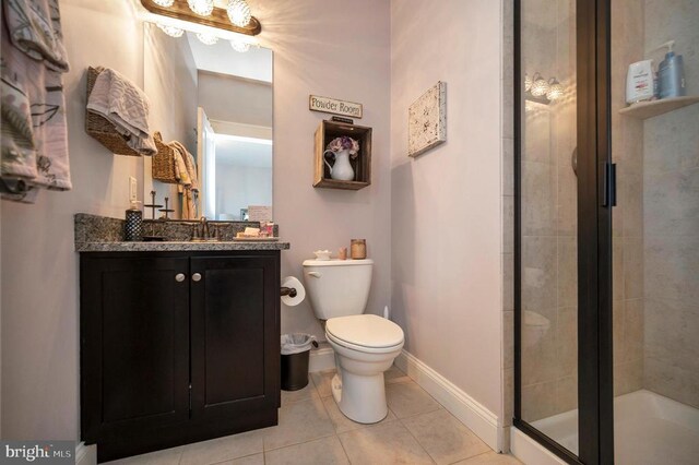 11001 Waterstone Pl, Spotsylvania, VA 22551 - full bath featuring toilet, vanity, a shower stall, tile patterned flooring, and baseboards