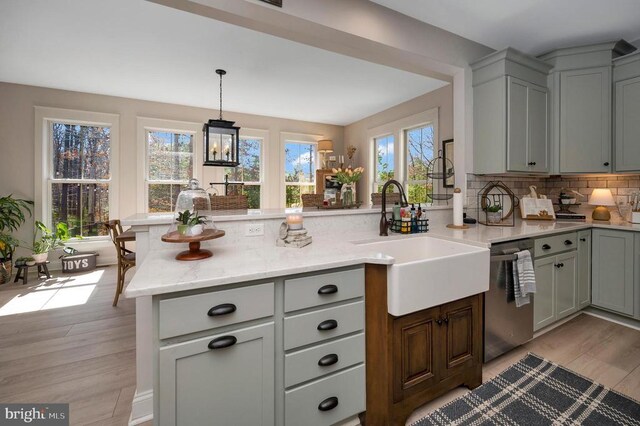 11001 Waterstone Pl, Spotsylvania, VA 22551 - kitchen with dishwasher, a sink, healthy amount of natural light, and tasteful backsplash
