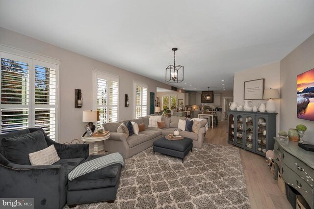 11001 Waterstone Pl, Spotsylvania, VA 22551 - living area with wood finished floors and a chandelier