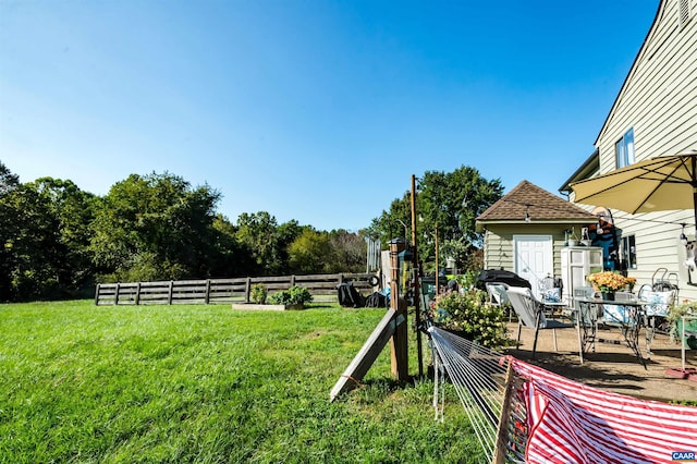 view of yard with a patio and fence