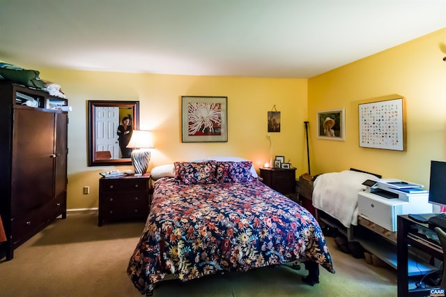 carpeted bedroom with baseboards