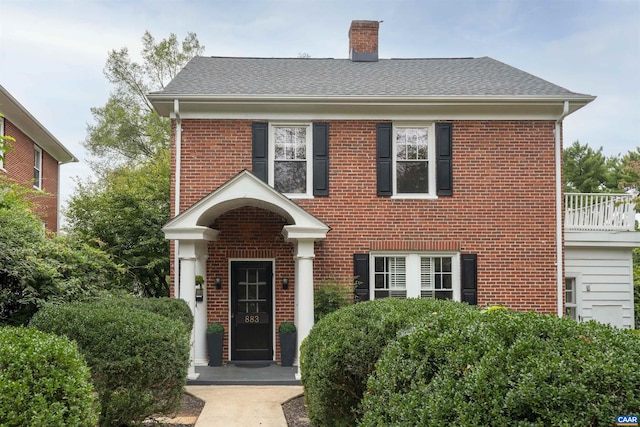 883 Locust Ave, Charlottesville, VA 22902 - view of front of property with a chimney, brick siding, and a shingled roof