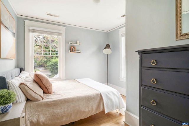 883 Locust Ave, Charlottesville, VA 22902 - bedroom featuring light wood-style floors and ornamental molding