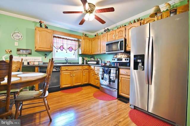 220 Airstrip Rd, Luray, VA 22835 - kitchen featuring stainless steel appliances, ornamental molding, dark countertops, ceiling fan, and light wood-type flooring