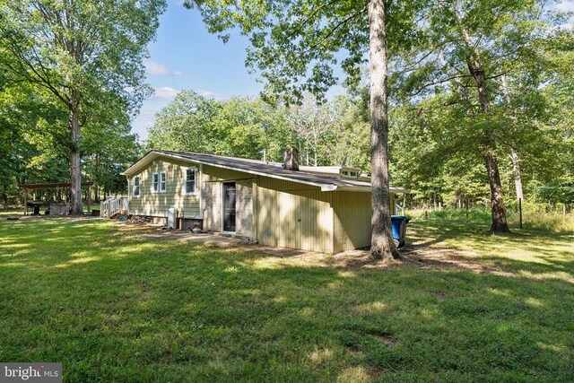 31055 Lumber Rd, Locust Grove, VA 22508 - view of home's exterior with a yard and view of wooded area