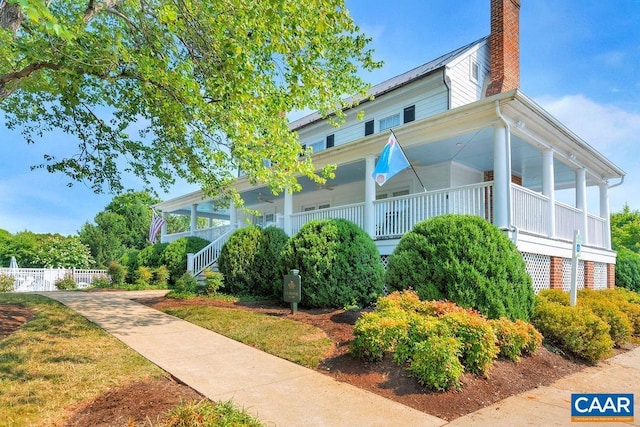 5031 Clearfields Ct, Crozet, VA 22932 - view of home's exterior featuring a chimney and covered porch