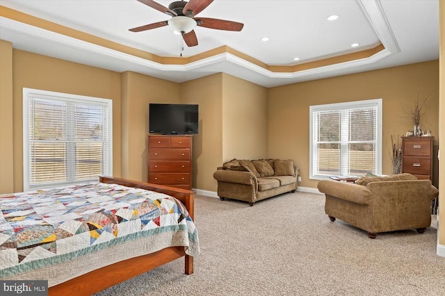 bedroom with carpet, recessed lighting, baseboards, ceiling fan, and a raised ceiling
