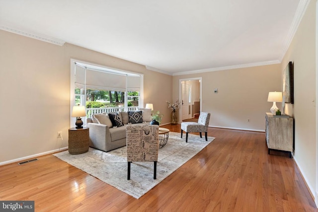  - living room with wood finished floors and ornamental molding