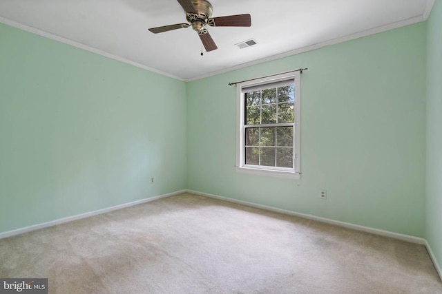  - unfurnished room featuring carpet flooring, ornamental molding, and a ceiling fan
