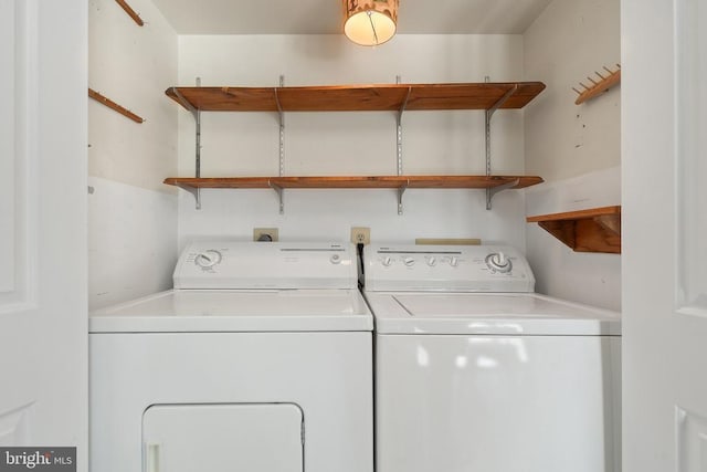  - laundry area featuring washing machine and clothes dryer