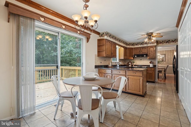  - dining room featuring light tile patterned floors, a chandelier, and a ceiling fan