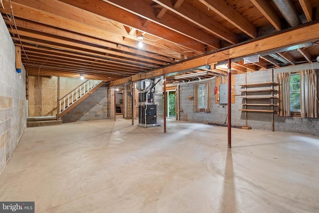  - below grade area featuring stairway and heating unit