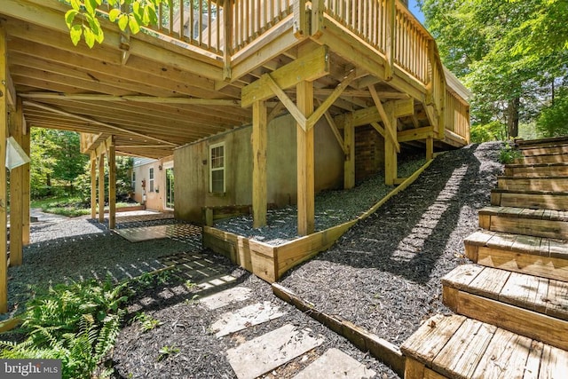  - view of patio / terrace featuring stairs and a deck
