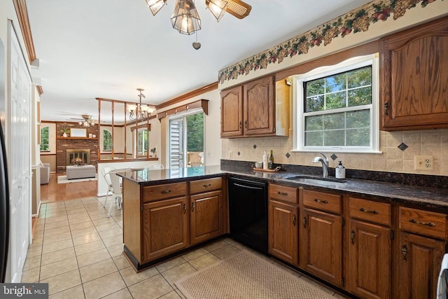  - kitchen featuring black dishwasher, a ceiling fan, healthy amount of natural light, and light tile patterned floors