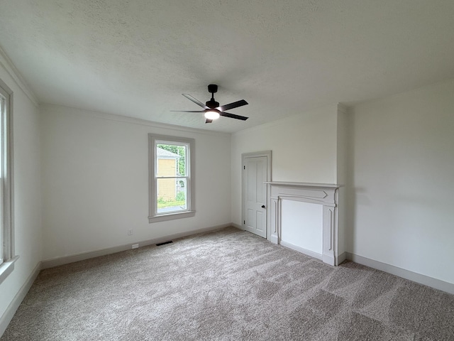 1203 Walnut St, Staunton, VA 24401 - carpeted empty room featuring a ceiling fan, ornamental molding, baseboards, and a textured ceiling