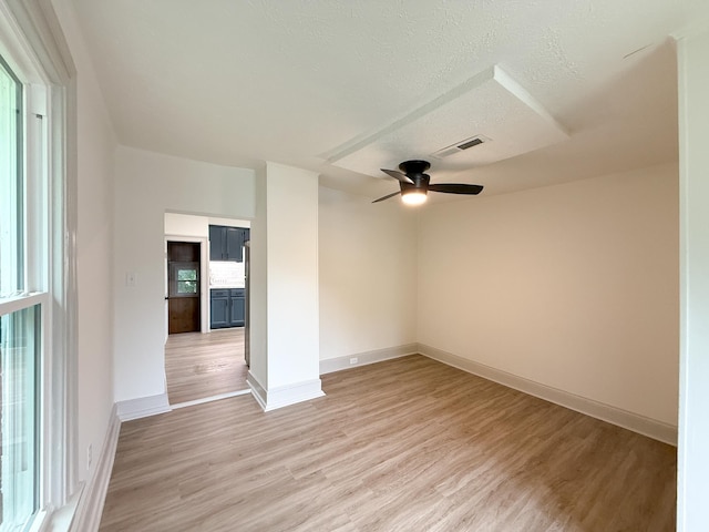 1203 Walnut St, Staunton, VA 24401 - unfurnished room with a ceiling fan, light wood-style flooring, baseboards, and a textured ceiling