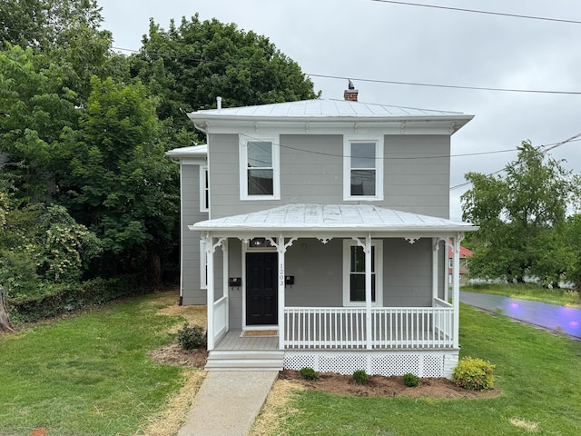 1203 Walnut St, Staunton, VA 24401 - view of front of property featuring a porch, a standing seam roof, a front lawn, and metal roof