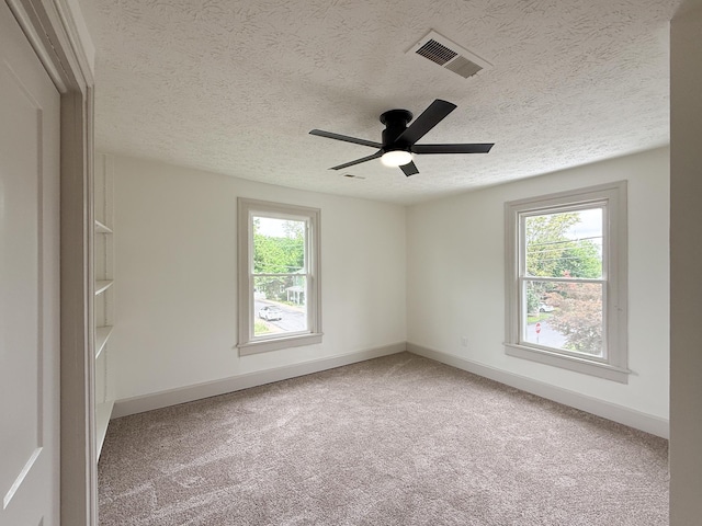 1203 Walnut St, Staunton, VA 24401 - carpeted spare room featuring plenty of natural light, a textured ceiling, baseboards, and ceiling fan
