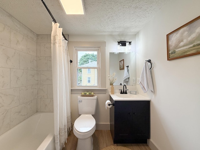 1203 Walnut St, Staunton, VA 24401 - bathroom with wood finished floors, toilet, vanity, shower / bath combo with shower curtain, and a textured ceiling
