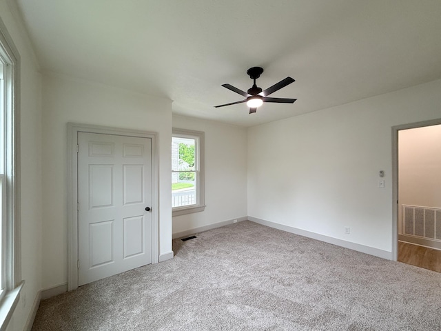 1203 Walnut St, Staunton, VA 24401 - unfurnished bedroom featuring carpet, baseboards, and a ceiling fan