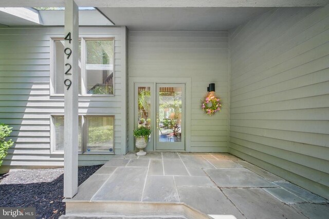  - doorway to property with a patio
